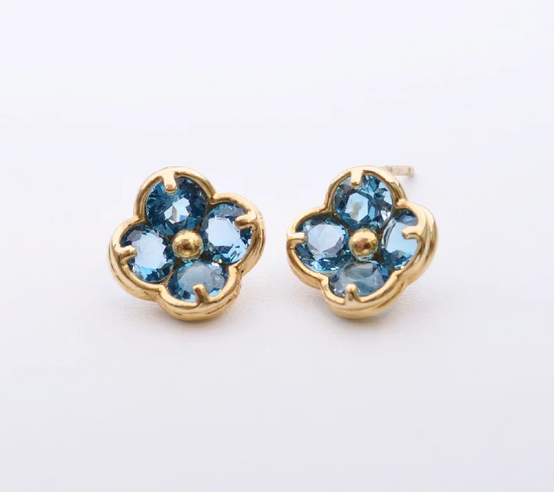 Classic Earrings for Every Occasion-14K yellow gold flower-shaped post earrings with Blue Topaz